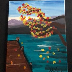 A beautiful painting of a lake in the autumn season.